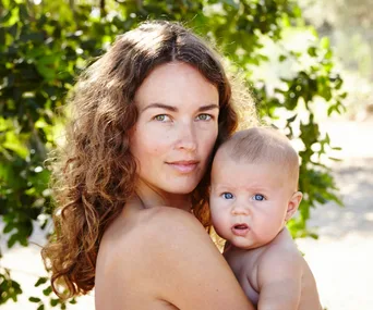 Mother and baby bare skin outdoors