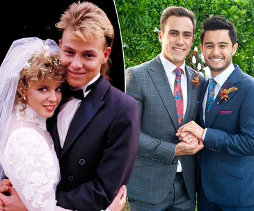 Couples from "Neighbours" in wedding attire: one pair in classic suits, the other in wedding dress and tuxedo.