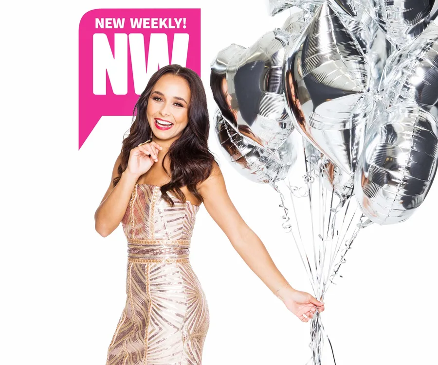 Woman in a sparkly dress holding silver balloons, smiling, with "New Weekly" logo in the background.