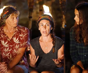 Three contestants from Australian Survivor 2018 in a tribal council discussion.