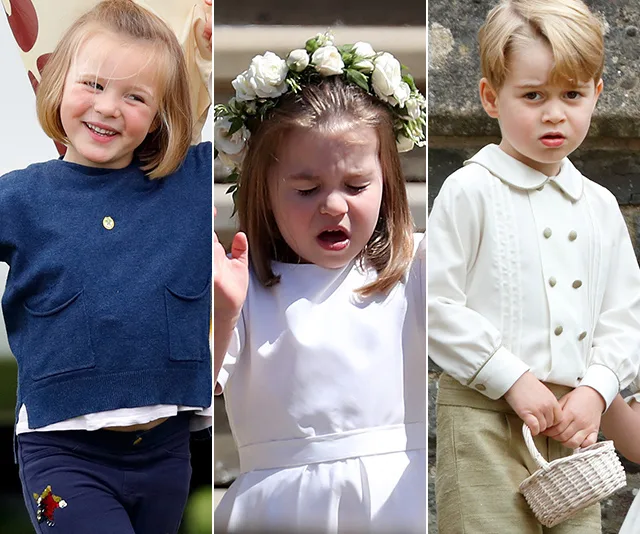 Three young children, one smiling, one with a flower crown, and one holding a basket, dressed for a formal event.