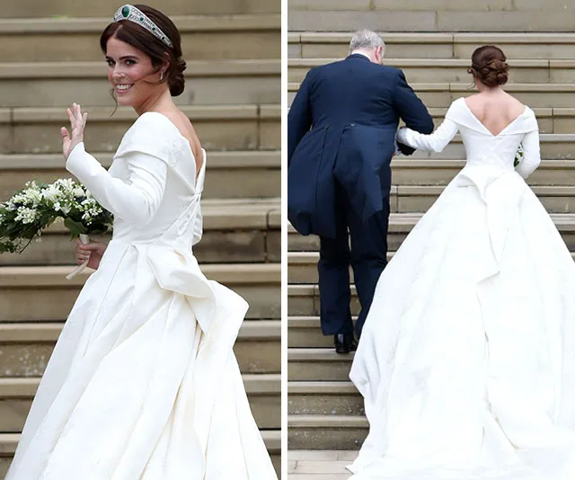 Princess Eugenie in a white wedding gown, holding a bouquet, waves on steps with companion.