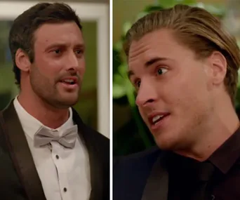 Two men in formal wear having a conversation, one in a bow tie, the other with slicked-back hair.