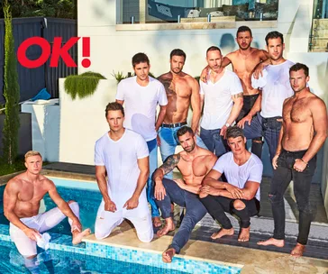 Group of ten men posed by a pool, some shirtless, wearing white or jeans, with "OK!" logo in the corner.