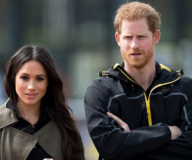 Don't know who they are; they stand outdoors, one wearing a jacket with an Invictus Games logo, the other in a coat.