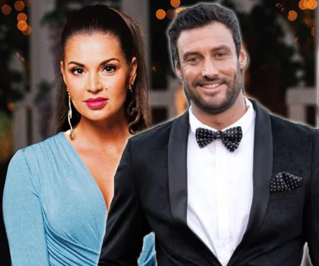 Couple elegantly dressed at a formal event, woman in blue dress, man in tuxedo with bow tie.