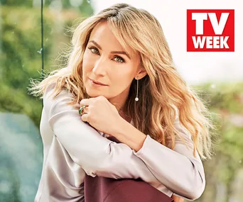 Blonde woman gazing softly, wearing silk blouse and dangling earrings, in front of blurred green background with "TV Week" logo.