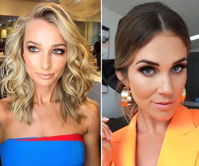 Blonde woman in blue and red top; brunette in orange jacket with large gold earrings.