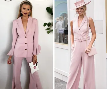 Two women in stylish pink outfits; one in a tailored suit and the other in a chic jumpsuit with a matching hat.