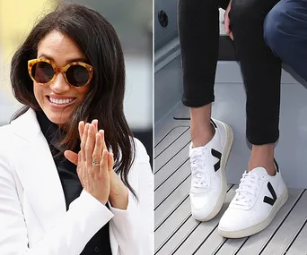 Meghan Markle in sunglasses and white sneakers with black logos.