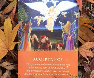 Angel card titled "Acceptance" depicting angels, fairies, and an inspiring message amid autumn leaves.