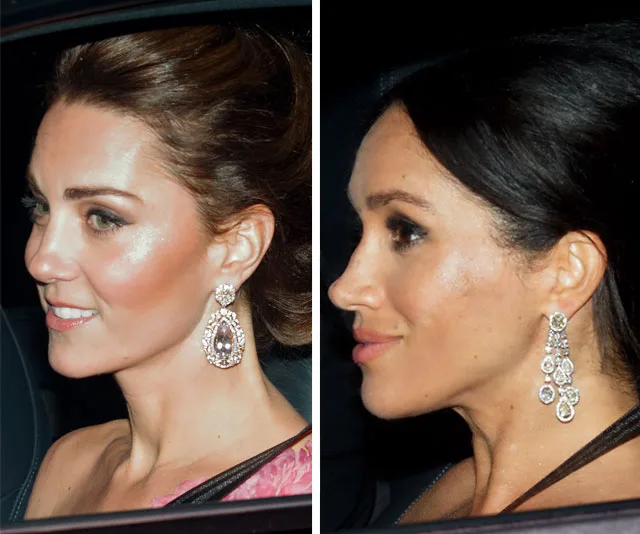 Two women wearing elegant earrings and evening attire during a night event, viewed in side profile.