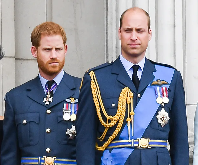 Two men in formal military uniforms, standing side by side, looking forward.