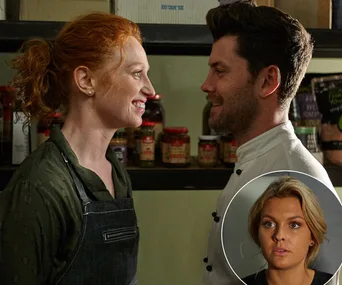 Red-haired woman and dark-haired man smiling at each other in a pantry, with an inset of a blonde woman looking concerned.