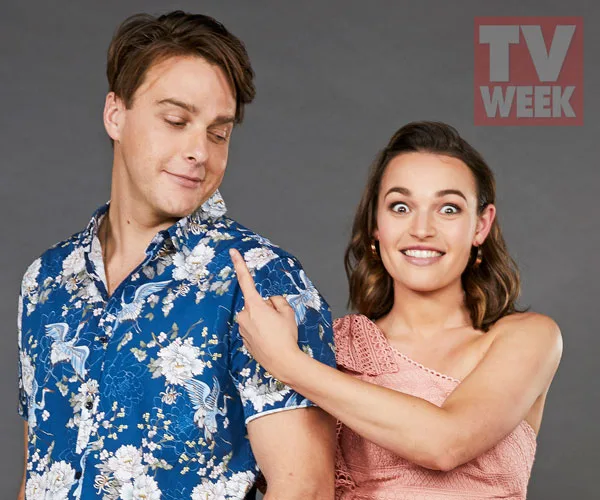 A woman playfully nudges a man's shoulder; man smiles looking sideways. TV Week logo in the corner.