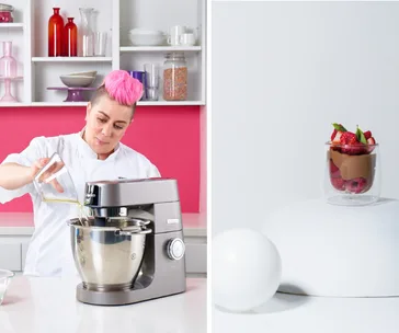 Chef with pink hair mixes ingredients; chocolate mousse with berries displayed on the right.