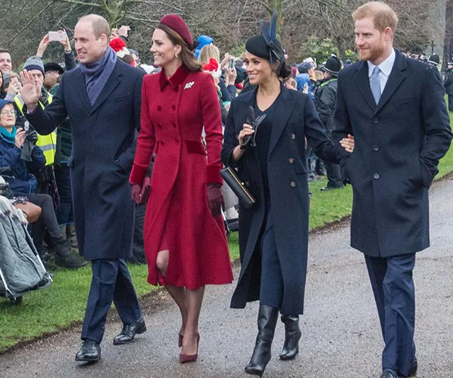 Four royals walking outdoors, smiling and interacting with onlookers, dressed in winter coats.