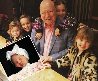 Bert Newton smiling with his grandchildren; inset shows a sleeping newborn in a white headband.