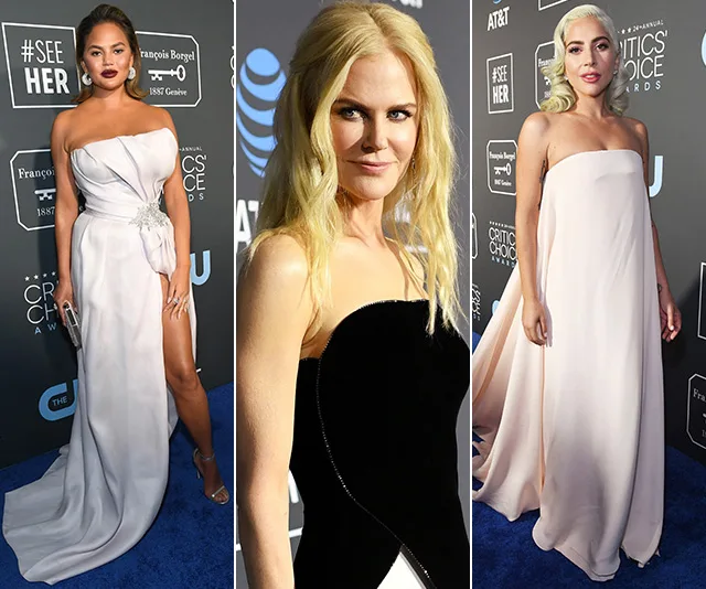 Three women in elegant gowns at the Critics' Choice Awards 2019, posing on the blue carpet.