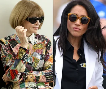 Two women wearing sunglasses; one in a colorful dress with a bob haircut, the other in a black shirt and white jacket.