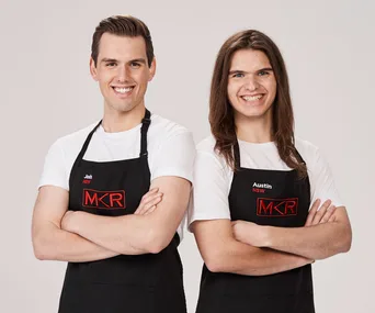 Two contestants from "My Kitchen Rules" in aprons, smiling with arms crossed.