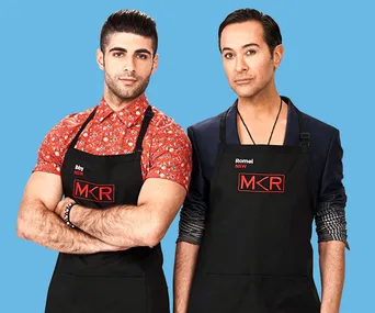 Two men wearing "MKR" aprons stand side by side against a blue background.
