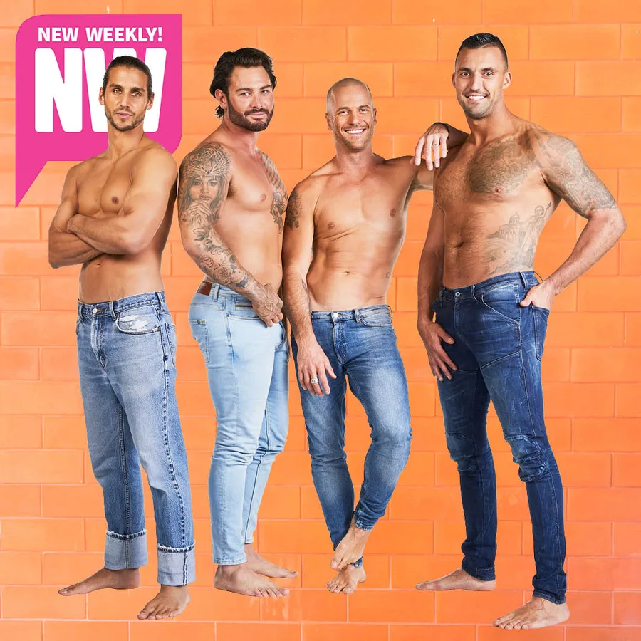 Shirtless men with tattoos in jeans posing against an orange brick wall, part of a magazine feature.