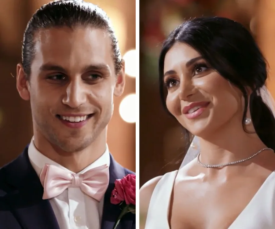 Bride and groom smiling at each other during a wedding ceremony on "Married at First Sight".