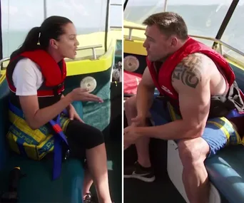 Two people in a boat, wearing life jackets, having a discussion on "Married at First Sight" episode.