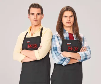 Two men in aprons with MKR logo, arms crossed, facing forward.