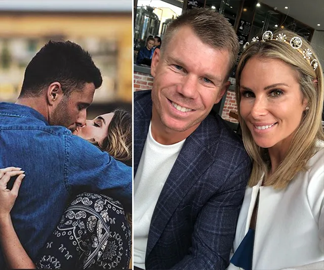 Couple on left kisses; couple on right smiles at the camera in restaurant.