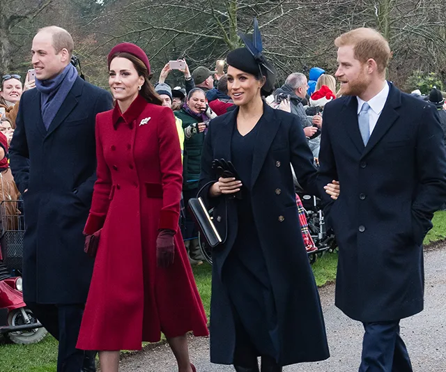 Royal couples walking outside, dressed in formal winter attire, with a crowd behind them.