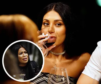 Alt text: "Two women at a dinner, one drinking wine, the other looking upset in an inset circle."
