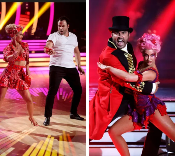 Two dancers performing on stage, wearing vibrant costumes under colorful lights in a dance competition.