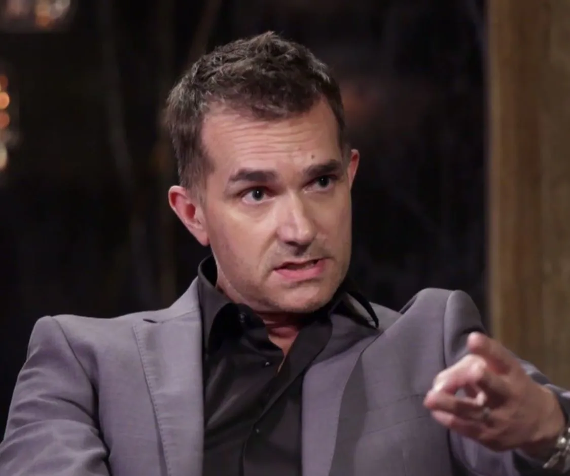 Man in a suit speaking during a commitment ceremony on "Married at First Sight."