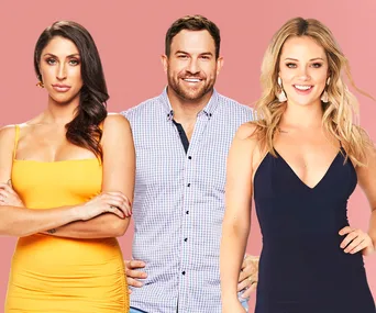 Three individuals from "Married at First Sight" standing against a pink background, dressed in formal attire.