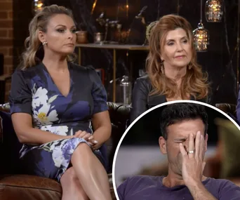 Two women sitting on a couch, one in floral dress, inset of a man facepalming.