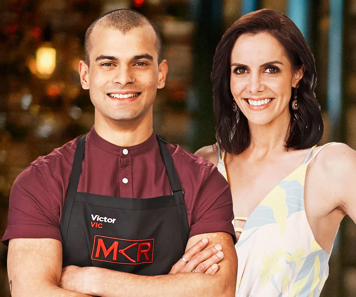 Victor and Piper from My Kitchen Rules, smiling together, with Victor in a maroon shirt and apron and Piper in a floral dress.