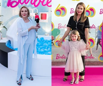 Barbie birthday event: Woman holding a Barbie doll; another woman with a child on a pink carpet; 60th-anniversary decor.