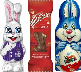 Three chocolate Easter bunnies: Cadbury Dairy Milk, Maltesers MaltEaster, and Kinder Surprise, all wrapped in festive packaging.