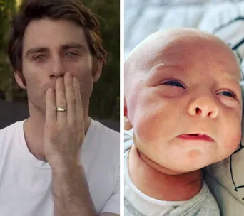 Man with hand over mouth and a baby looking up.