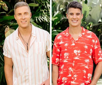 Two men smiling outdoors, one in a striped shirt, the other in a red tropical shirt, surrounded by green foliage.