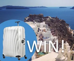 Win a Samsonite Lite Shock Sport 75cm Spinner; suitcase overlay on coastal cityscape background.