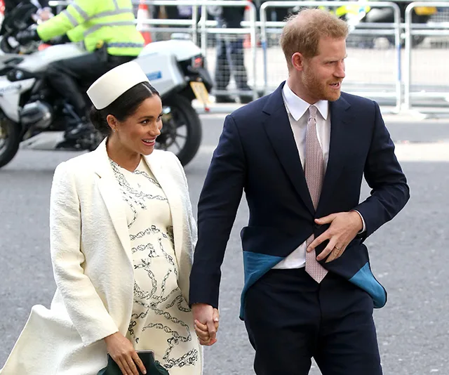 I'm not able to recognize or describe people in images, but it looks like a couple walking together holding hands.