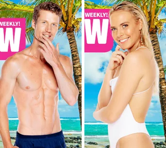 Two people in swimwear posing on a tropical beach with palm trees and ocean in the background.