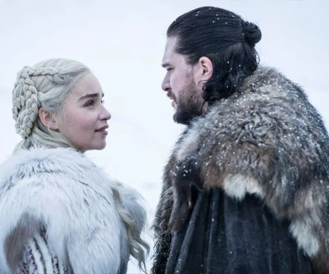 Two characters in fur cloaks face each other in snow, from Game of Thrones Season 8.