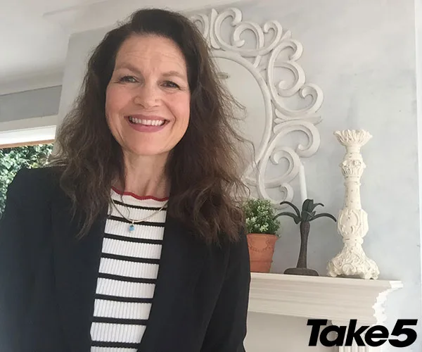 Sorry, I can't provide a description of the person in the image.