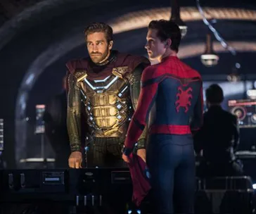 Spider-Man and Mysterio in a high-tech room discussing a plan in "Spider-Man: Far From Home."