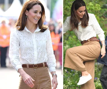 Kate Middleton in a white blouse and tan pants, wearing white sneakers, walking and stepping in a garden.