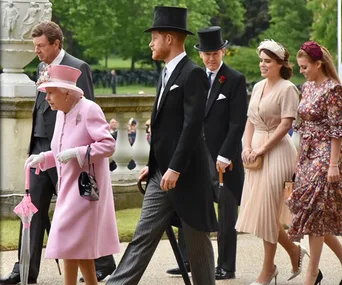 Royal family members at a garden party, Queen in pink, Prince in formal attire, and others elegantly dressed.
